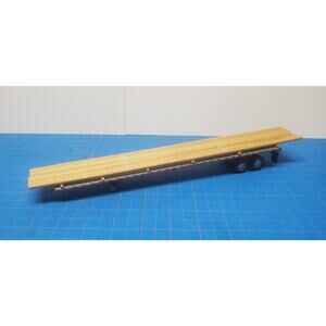 DCP Flatbed Trailer with Utility Pole Load